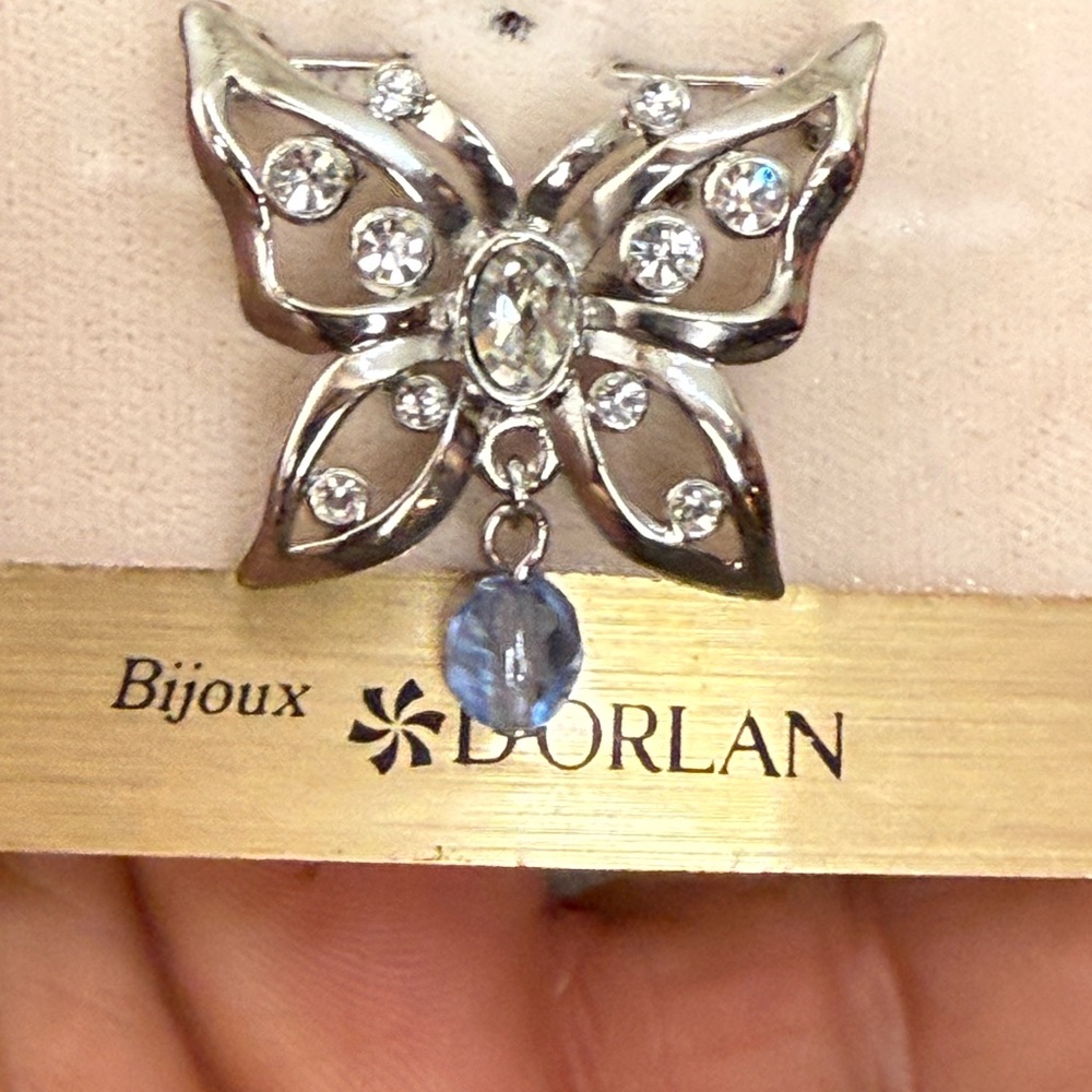 NWT D'Orlan rhodium-plated butterfly brooch accented with Swarovski crystals.
